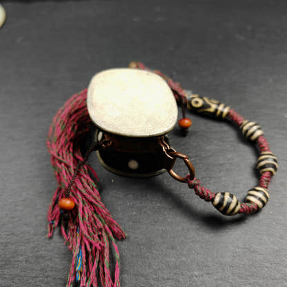 Portable Tibetan Chöd - Damaru Drum - Tibetan Buddhist art, close-up detail
