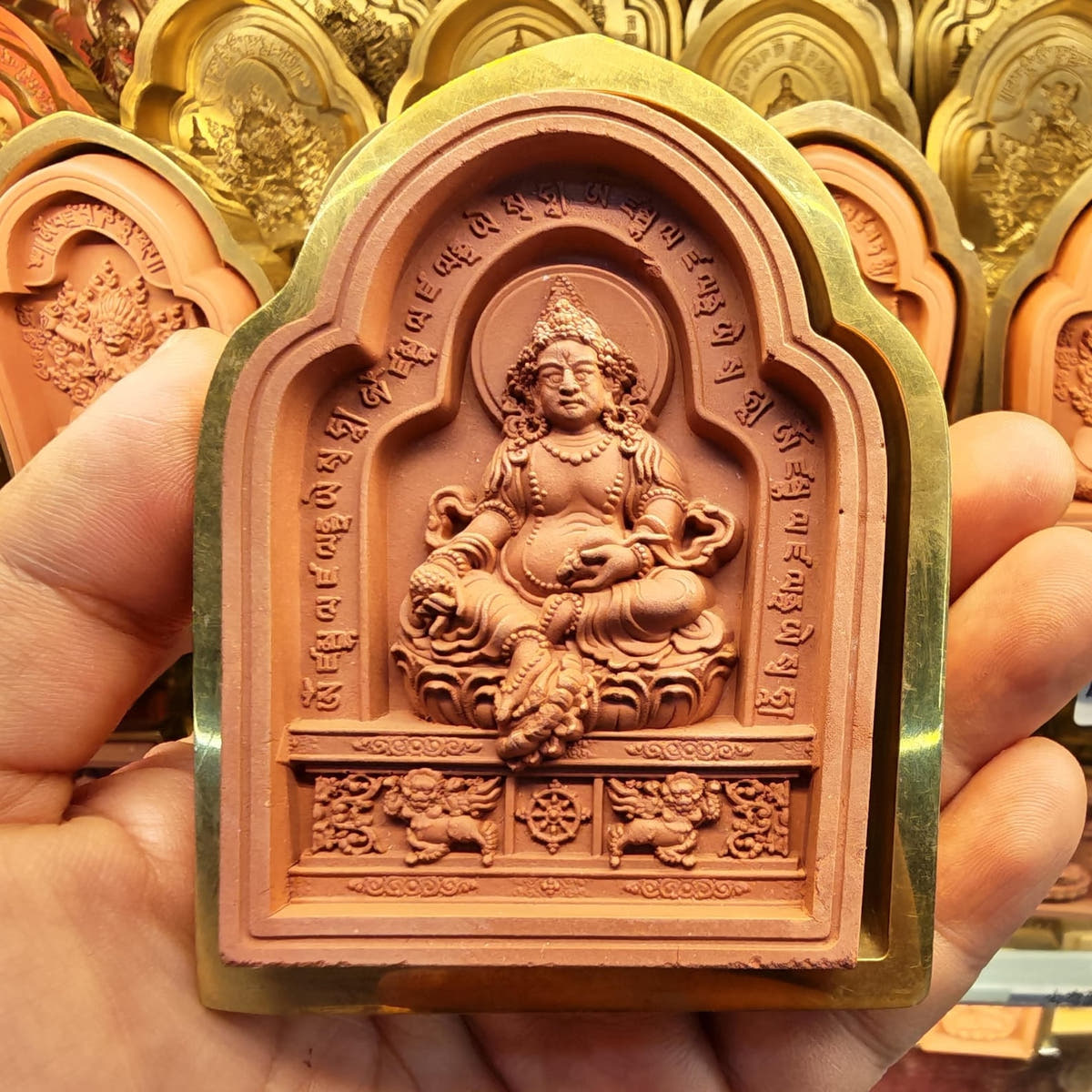 Bordered Yellow Jambhala Tsa Tsa Mold - Tibetan tsa tsa mold, front view
