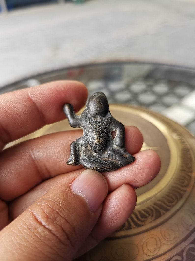 Buddhist Protective Pendant,Abstract Wrathful Vajrapani Amulet Badge,Made of Tho - Tibetan Buddhist amulet, close-up detail