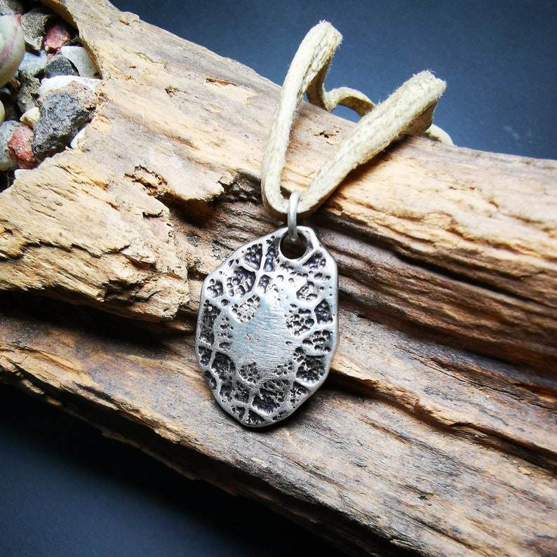 Protective Pendant,Om Mani Padme Hum Mantra Amulet - Tibetan Buddhist amulet, close-up detail