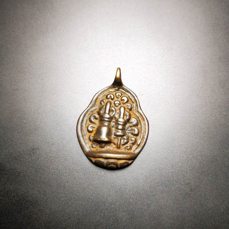 Buddhist Protective Amulet Pendant,A Tibetan vajra club and tribu bell ,80 years - Tibetan Buddhist amulet, close-up detail