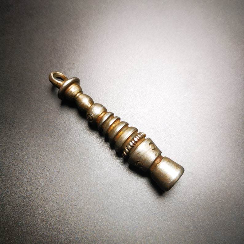 Buddhist Ritual,Stupa,Pagoda,Buddhist Tower Amulet Pendant,Made of Cold Iron - Tibetan Buddhist amulet, close-up detail