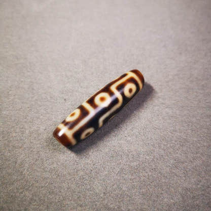 9 Eyes Dzi Bead - Tibetan dzi bead, close-up detail