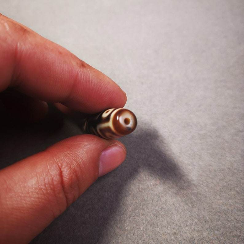 9 Eyes Dzi Bead - Tibetan dzi bead, size reference