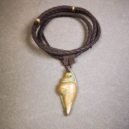 Small Shankha Divine Conch Badge,Tibetan Buddhist Protective Amulet Pendant,Made - Tibetan Buddhist amulet, close-up detail