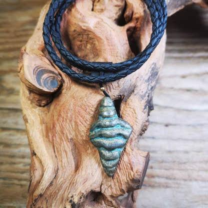 Shankha Divine Conch Badge,Tibetan Buddhist Protective Amulet Pendant,Made of Li - Tibetan Buddhist amulet, front view