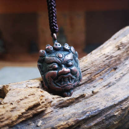 Amulet Badge,Mahakala Pendant, Buddhist Protector Deity, 50 Years Old - Tibetan Buddhist amulet, close-up detail