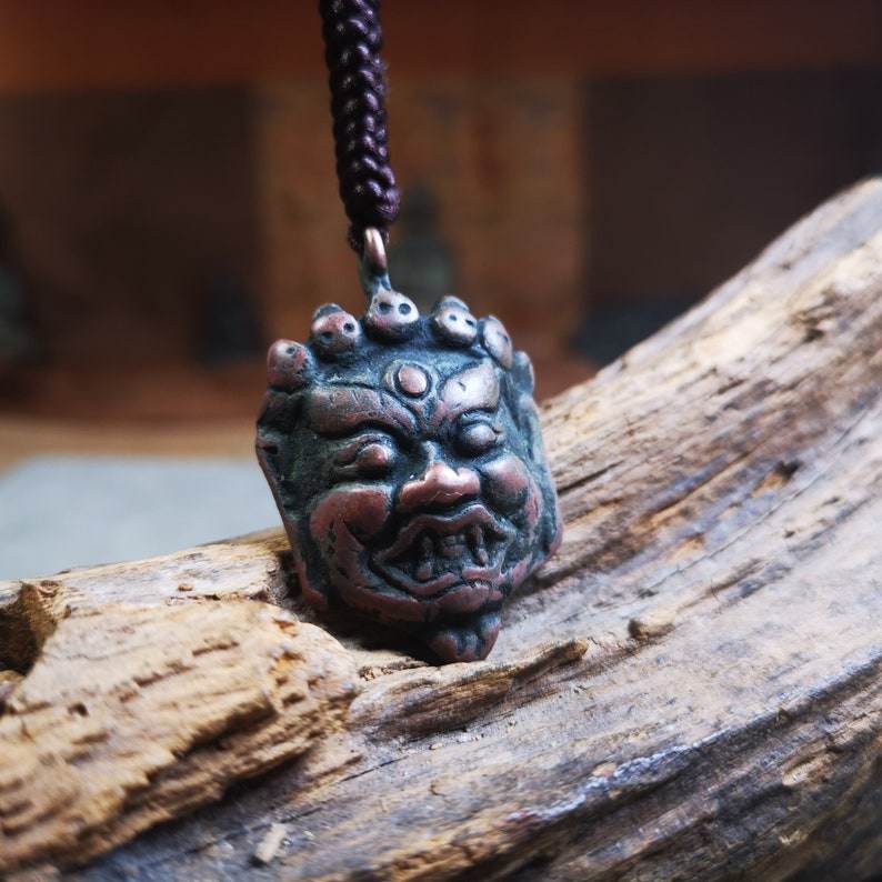 Amulet Badge,Mahakala Pendant, Buddhist Protector Deity, 50 Years Old - Tibetan Buddhist amulet, close-up detail