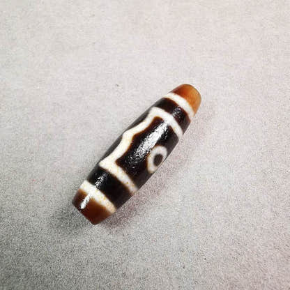 3 Eyed Dzi Bead - Tibetan dzi bead, close-up detail