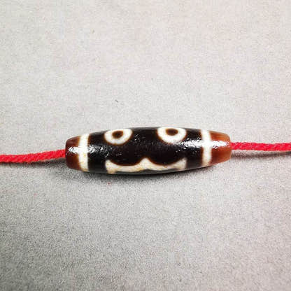 3 Eyed Dzi Bead - Tibetan dzi bead, front view