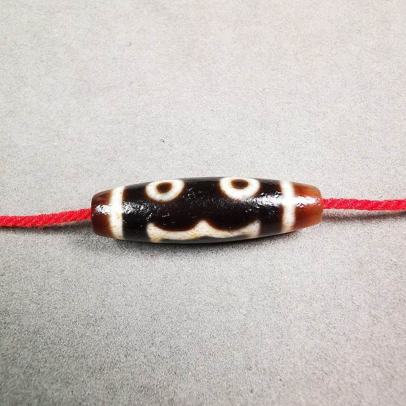 3 Eyed Dzi Bead - Tibetan dzi bead, front view