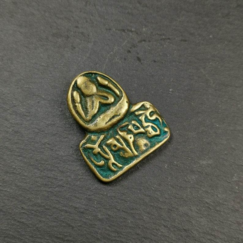 Amulet,Chenrezig Pendant Badge with Mantra Om Mani Padme Hum - Tibetan Buddhist amulet, front view