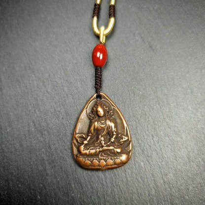 Statue Amulet,Green Tara Pendant - Tibetan Buddhist amulet, close-up detail