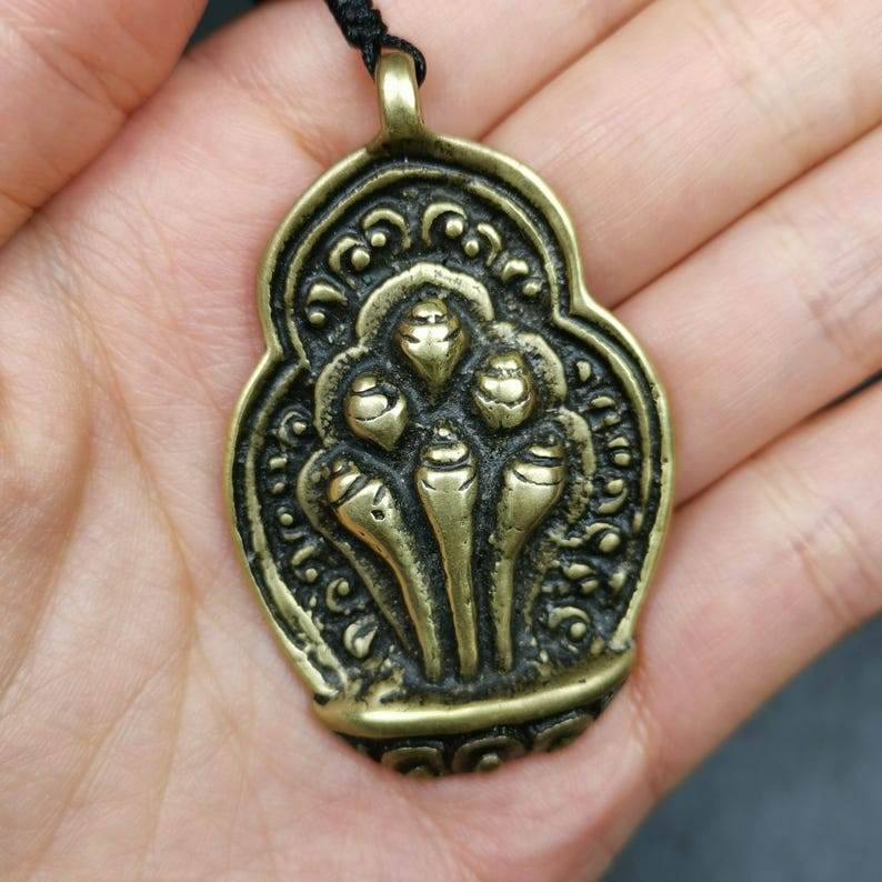 Amulet,Mani Jewel Badge/Pendant - Tibetan Buddhist amulet, close-up detail