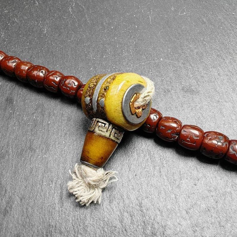 T-drilled 3-Hole Connector Bead - Tibetan Buddhist art, close-up detail