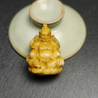 Buddha statue - Yellow Jambhala Dzambhala - Tibetan Buddhist statue, detailed view