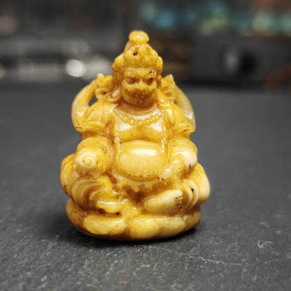 Buddha statue - Yellow Jambhala Dzambhala - Tibetan Buddhist statue, front view