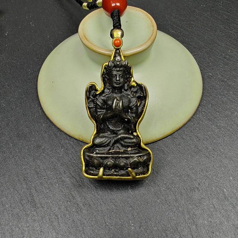 Buddha Statue Amulet, Pendant - Tibetan Buddhist amulet, close-up detail