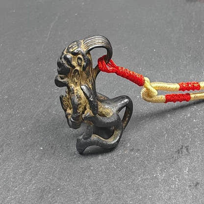 Garuda Amulet, Tibetan Buddhist Pendant,Golden-winged Bird - Tibetan Buddhist amulet, close-up detail