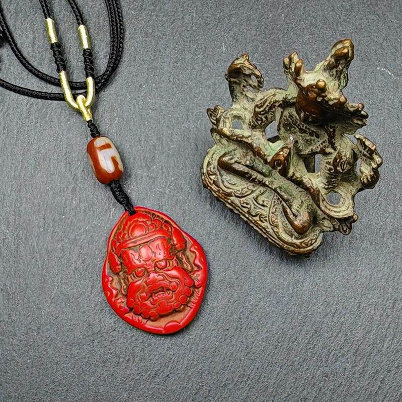 Old Cinnabar Mahakala Amulet with Dzi Bead - Tibetan dzi bead, detailed view