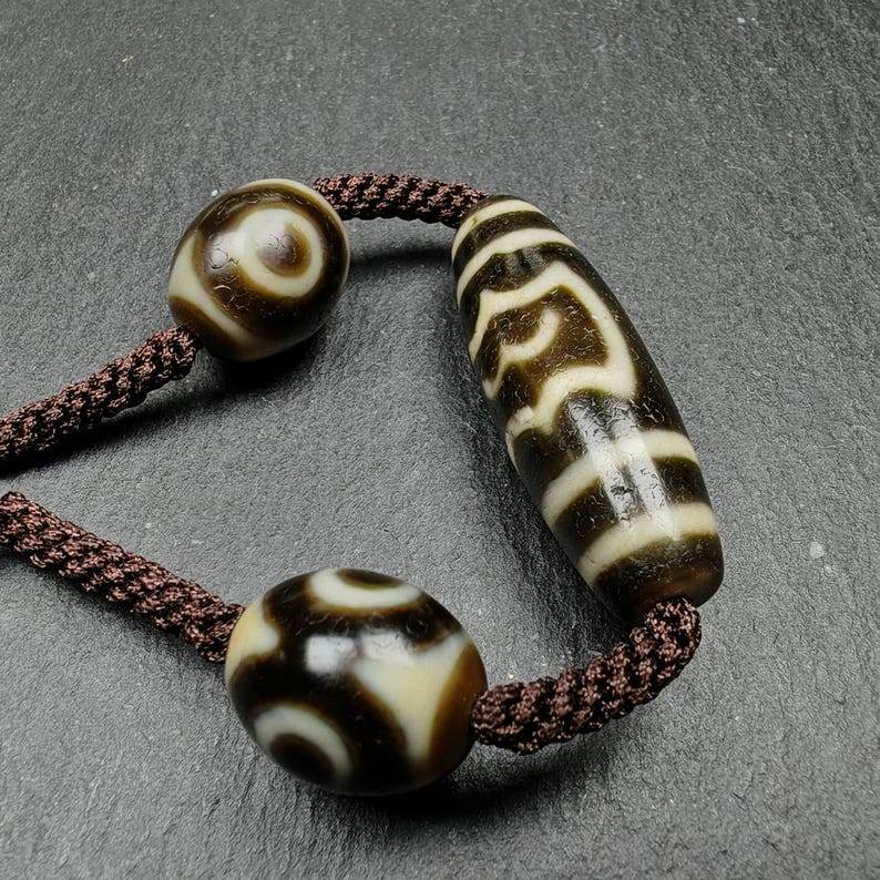 Tibetan Dzi Necklace - Garuda Dzi + 3 Eyes Dalo Dzi Amulet - Tibetan Buddhist bead necklace, detailed view