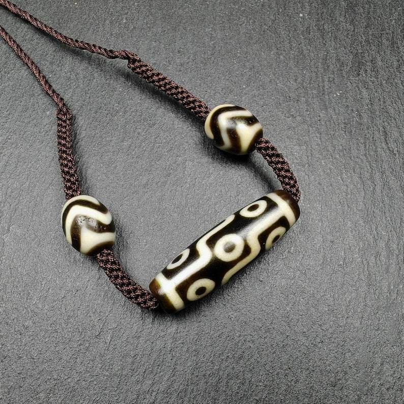 Tibetan Dzi Necklace,9 Eyes Dzi + 2 Wave Darlo Dzi Beads Amulet - Tibetan Buddhist bead necklace, front view