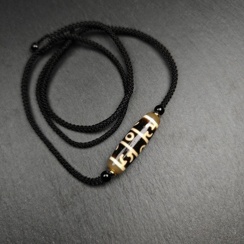 Tibetan Guru Rinpoche Three Realms Dzi Bead Amulet,38 - Tibetan dzi bead, detailed view