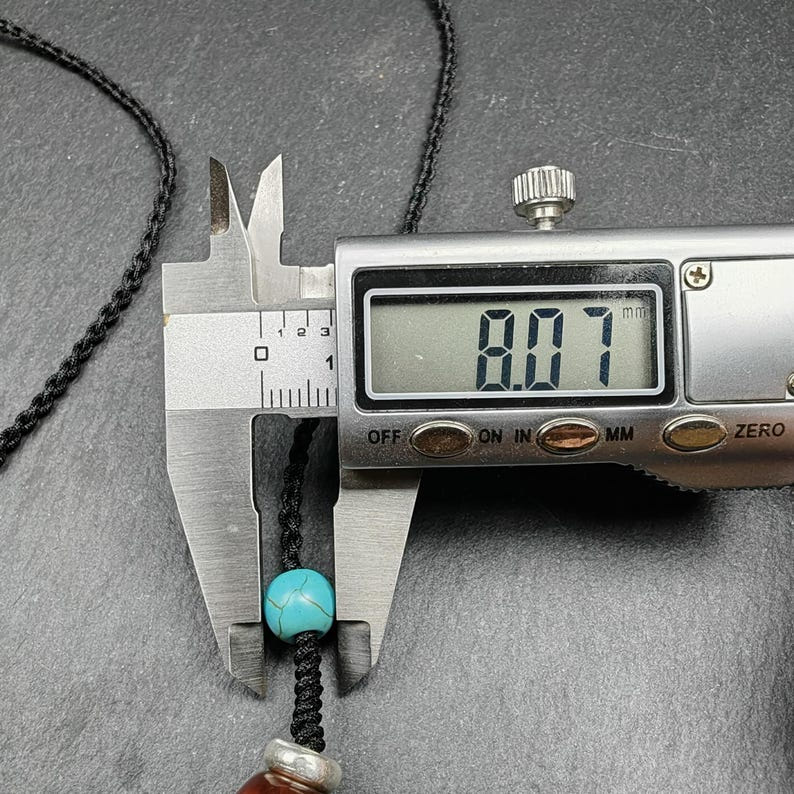 Fire Agate Lotus Dzi Amulet 31 - Tibetan dzi bead, size reference