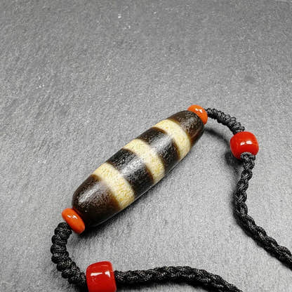 Stripe Dzi Bead Amulet - Tibetan dzi bead, close-up detail
