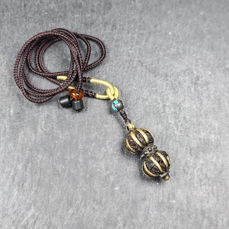 Vajra Amulet Tibetan Protective Charm with Consecration Filled 35*15mm - Tibetan Buddhist amulet, close-up detail