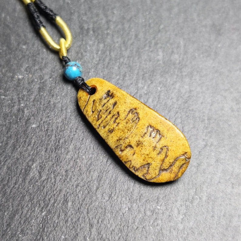 Antique Shield-shaped Kapala Amulet - 46mm - Tibetan Buddhist amulet, front view