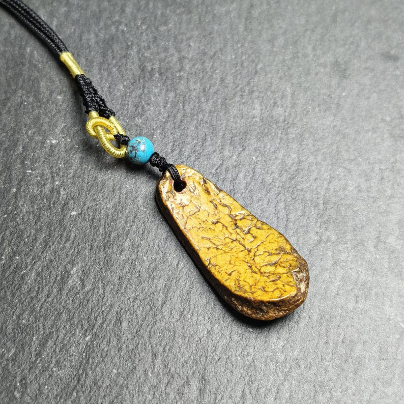 Antique Shield-shaped Kapala Amulet - 46mm - Tibetan Buddhist amulet, detailed view