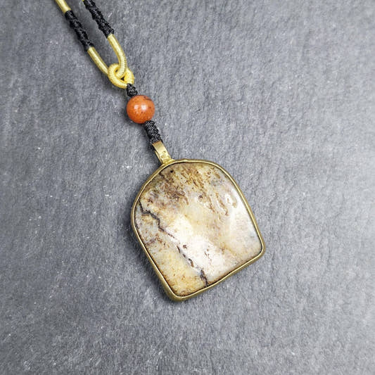 Antique Shield-shaped Kapala Amulet 36mm - Tibetan Buddhist amulet, front view