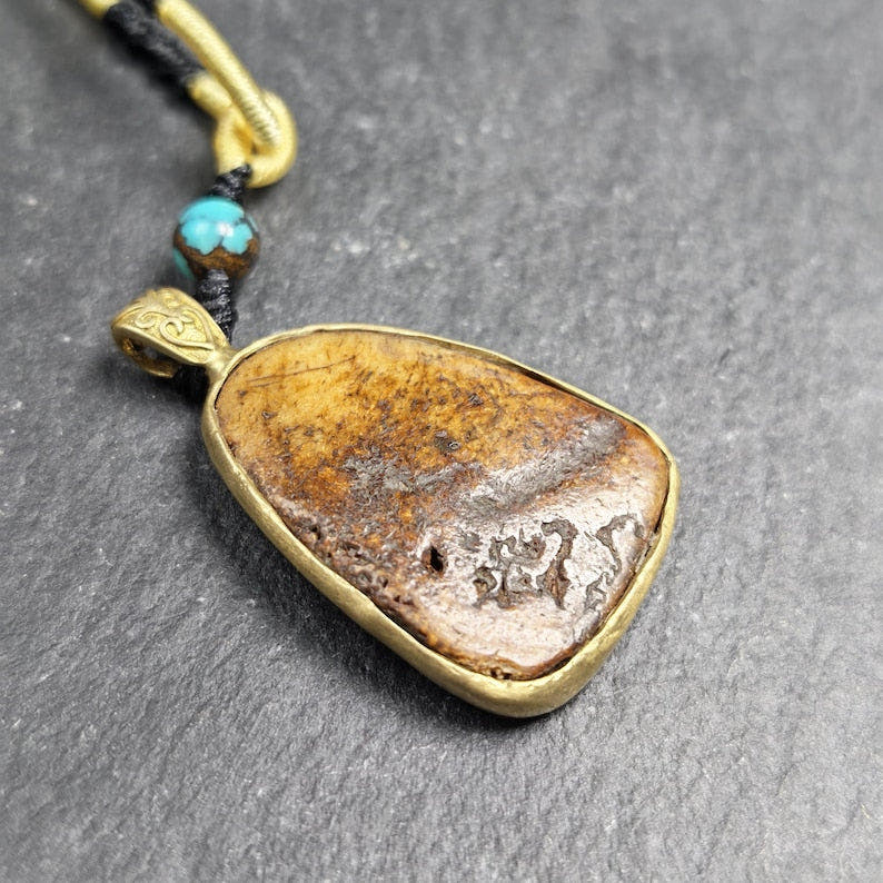 Shield-shaped Kapala Amulet - 33mm - Tibetan Buddhist amulet, close-up detail