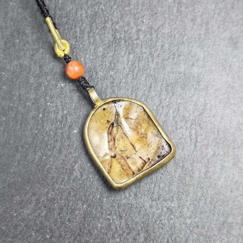 Antique Shield-shaped Kapala Amulet 36mm - Tibetan Buddhist amulet, detailed view