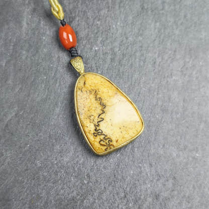 Shield-shaped Kapala Amulet - 37mm - Tibetan Buddhist amulet, front view