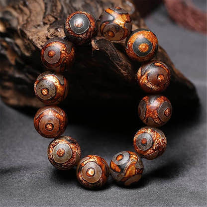 3 Eyes Dzi Bead Bracelet - Tibetan Buddhist mala beads, detailed view