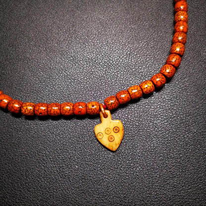 Bone Carved Nubro Pendant - Tibetan Buddhist art, detailed view
