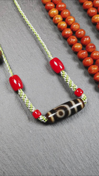This necklace was hand-woven by Tibetans from Baiyu County, the main bead is a 2 eyed dzi bead, paired with agate beads,about 30 years old. It can be worn as a fashionable accessory, also holds cultural and religious significance.