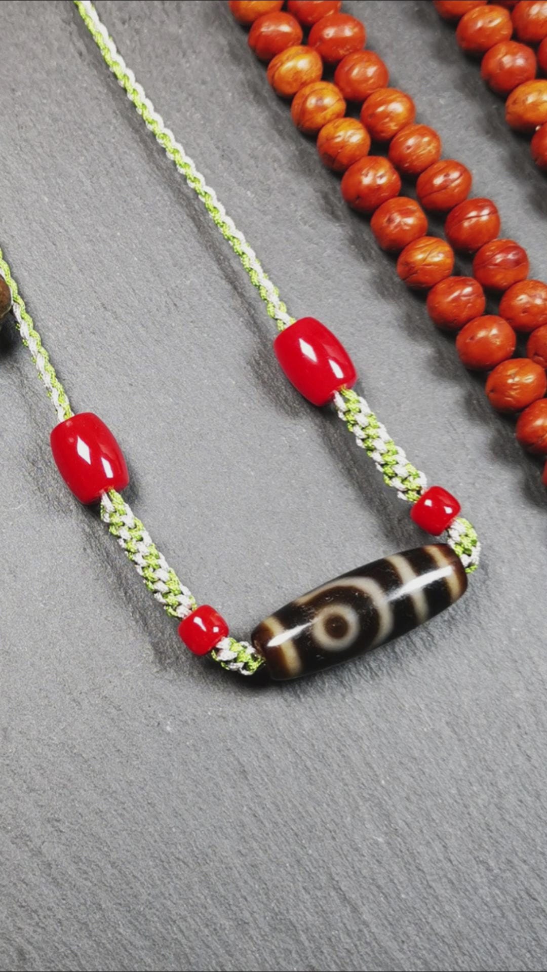 This necklace was hand-woven by Tibetans from Baiyu County, the main bead is a 2 eyed dzi bead, paired with agate beads,about 30 years old. It can be worn as a fashionable accessory, also holds cultural and religious significance.
