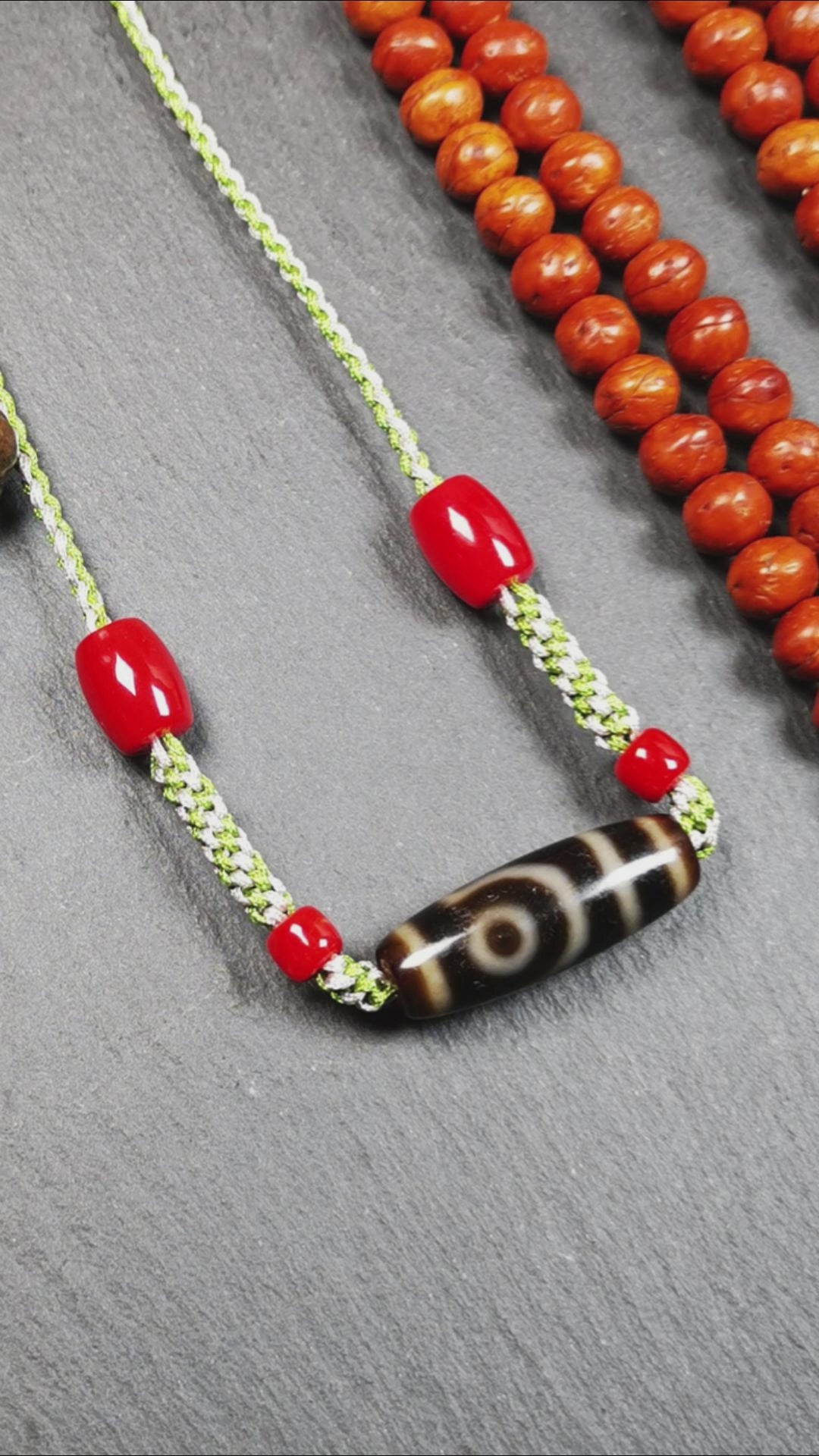 This necklace was hand-woven by Tibetans from Baiyu County, the main bead is a 2 eyed dzi bead, paired with agate beads,about 30 years old. It can be worn as a fashionable accessory, also holds cultural and religious significance.