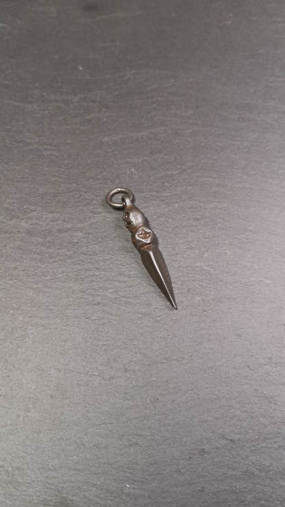 This phurba was made by Tibetan craftsmen and come from Hepo Town, Baiyu County,Tibet. Its upper part is Shmashana Adhipati skull, the lower part is a Dorje Phurba,and a copper dot inlaid on the waist of the phurba