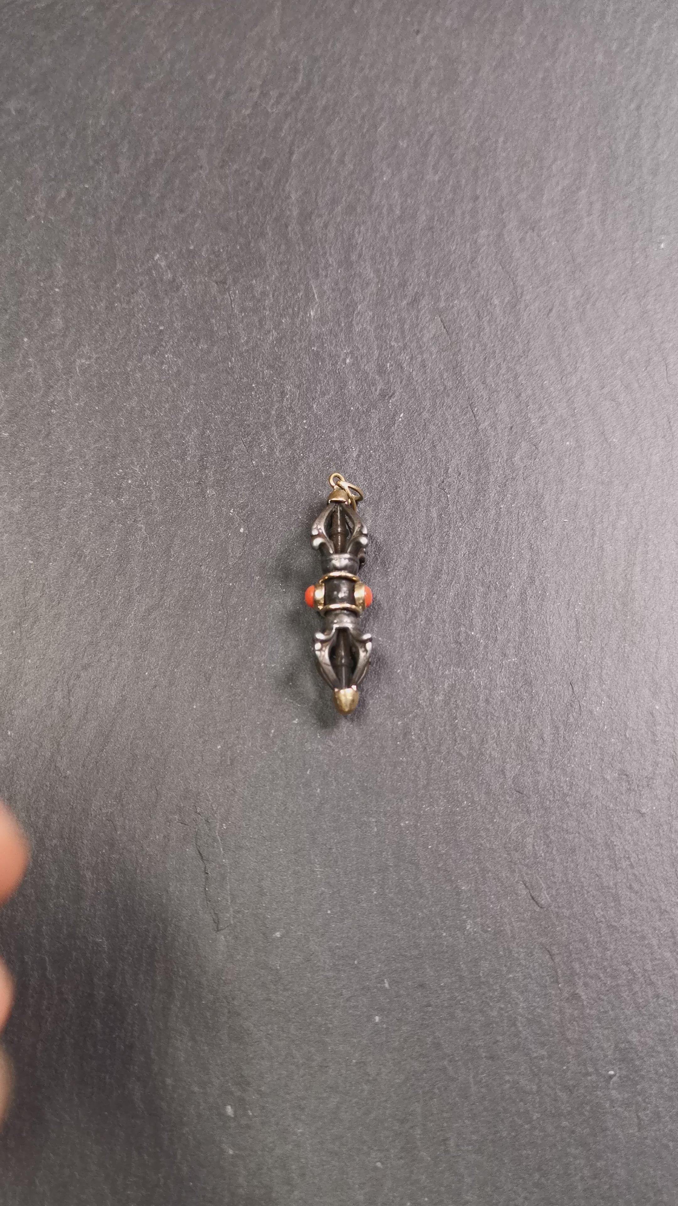 This unique vajra pendant was handmade by Tibetan craftsmen from Tibet in 1990's,from Hepo Town, Baiyu County, the birthplace of the famous Tibetan handicrafts. It is five-pronged Vajra,made of cold iron, 1.77 inch height.Comes with leather cord. You can make it a necklace, pendant, keychain, mala pendant, or just as an ornament on your desk.