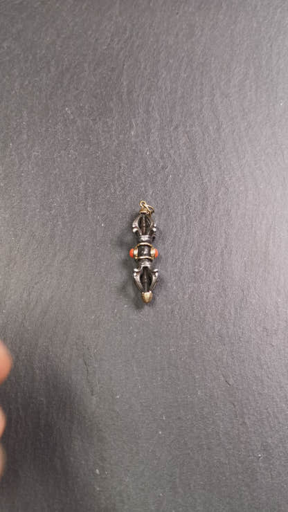 This unique vajra pendant was handmade by Tibetan craftsmen from Tibet in 1990's,from Hepo Town, Baiyu County, the birthplace of the famous Tibetan handicrafts. It is five-pronged Vajra,made of cold iron, 1.77 inch height.Comes with leather cord. You can make it a necklace, pendant, keychain, mala pendant, or just as an ornament on your desk.
