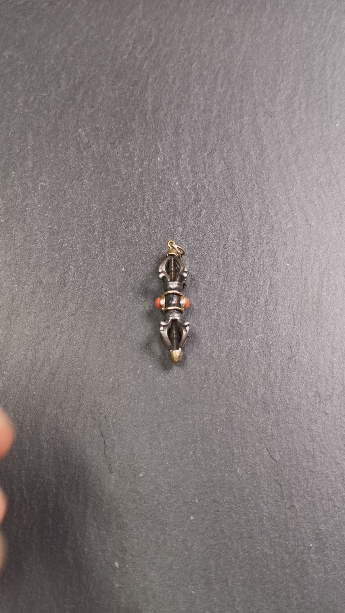 This unique vajra pendant was handmade by Tibetan craftsmen from Tibet in 1990's,from Hepo Town, Baiyu County, the birthplace of the famous Tibetan handicrafts. It is five-pronged Vajra,made of cold iron, 1.77 inch height.Comes with leather cord. You can make it a necklace, pendant, keychain, mala pendant, or just as an ornament on your desk.