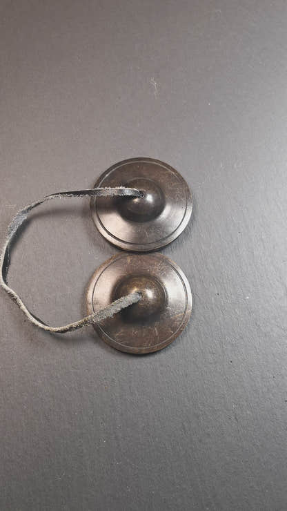 This tingsha bell set was handmade in Nepal,using traditional techniques and materials. It was made of brass,dark color,6.5cm diameter,with pure, clear and resonant,good for meditation. Come with tingsha case.