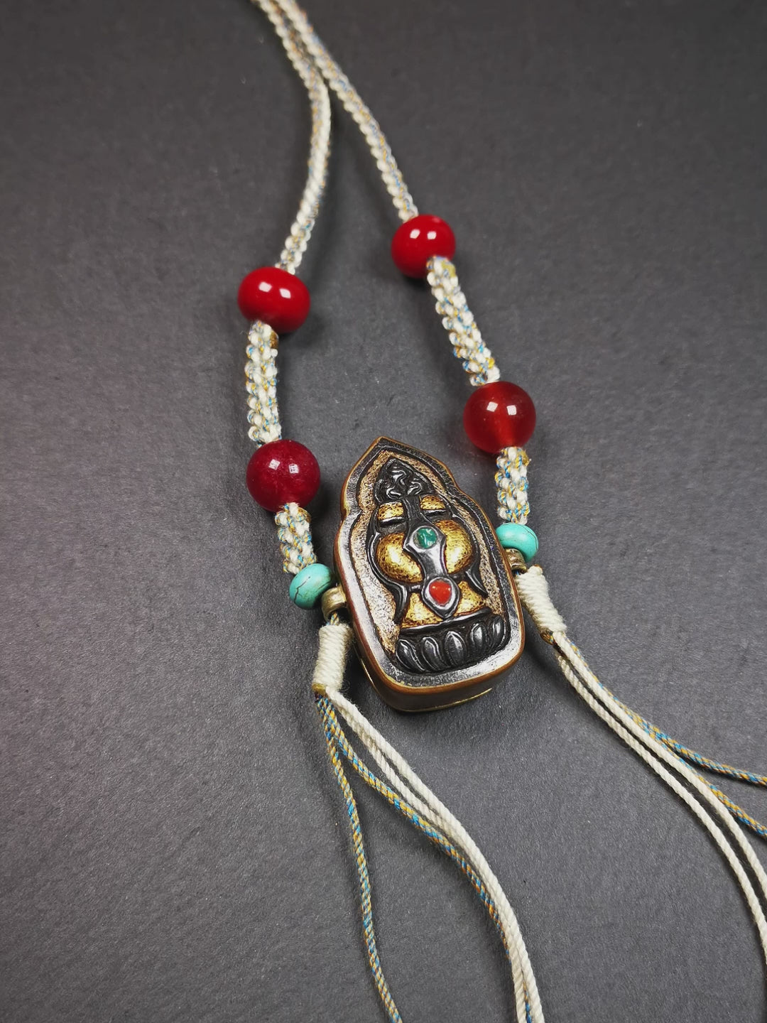 This portable Gau shrine was handcrafted by Tibetan artisans.  Its theme is mani jewel, a treasure vase on a lotus base, inside the vase are mani jewels and other jewels. Each exquisite pattern on it is meticulously hand-carved,and it is embellished with the technique of gold inlay, with cold iron and pure silver inlaid on the red copper material and gold-plated on the pure silver material,inlaid with turquoise and agate bead. 