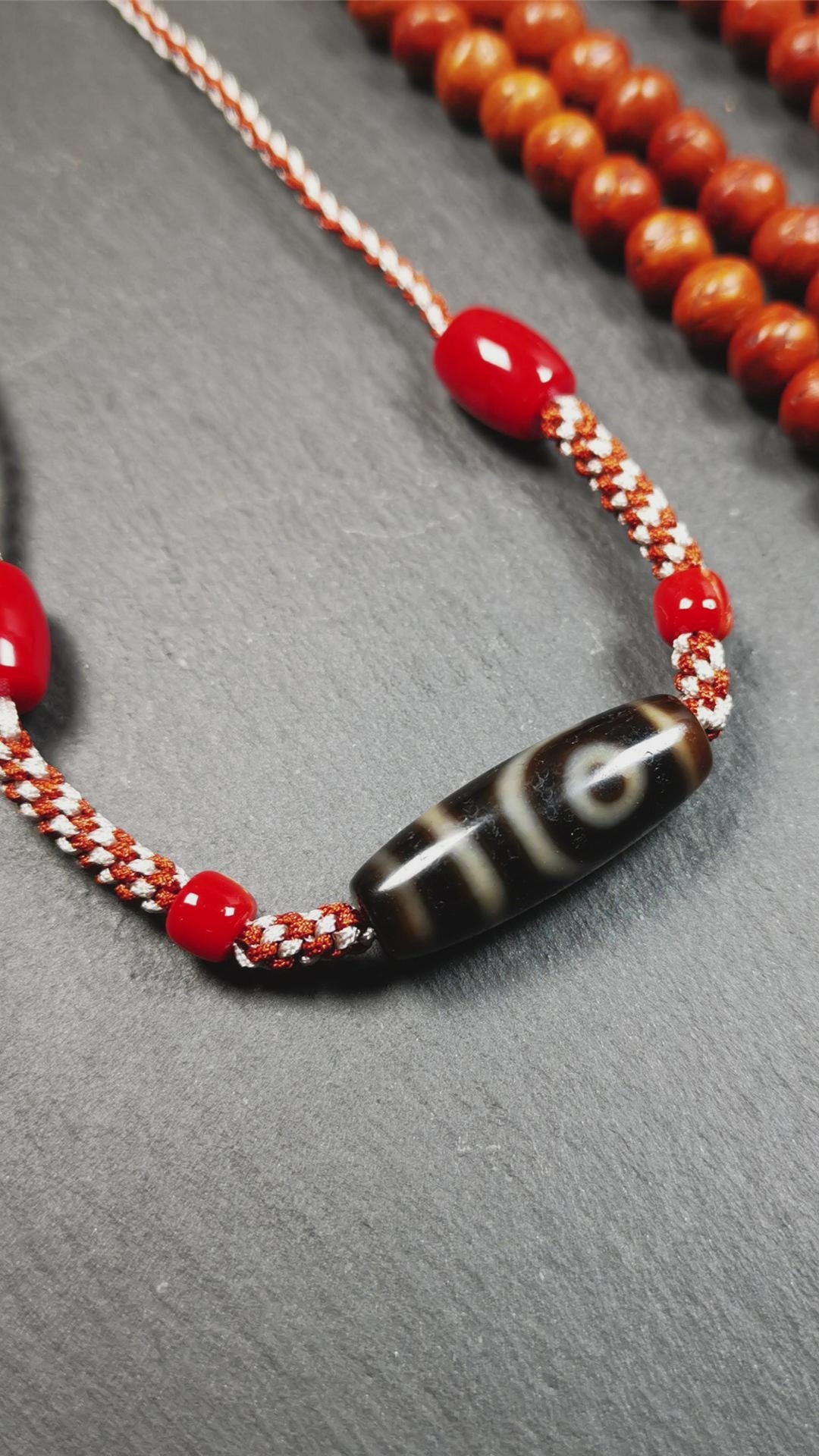 This necklace was hand-woven by Tibetans from Baiyu County, the main bead is a 2 eyed dzi bead, paired with agate beads,about 30 years old. It can be worn as a fashionable accessory, also holds cultural and religious significance.