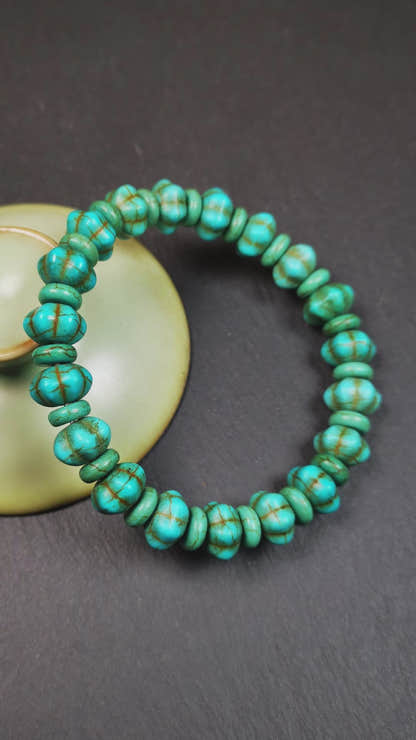 This beautiful turquoise bracelet is handmade from Tibet in 1980's. It's green color, made of turquoise, 19 hexagon beads and 19 spacer beads in total,7.4 inches circumference,0.47 width.