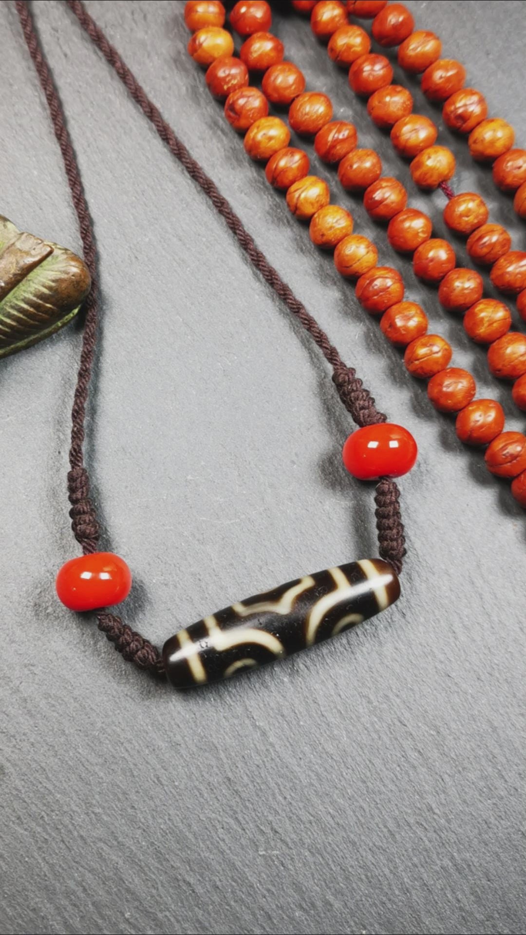 This necklace was hand-woven by Tibetans from Baiyu County, the main bead is a 3 eyed dzi bead, paired with 2 agate beads,about 30 years old. It can be worn not only as a fashionable accessory but also holds cultural and religious significance.